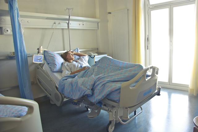 person laying in hospital bed