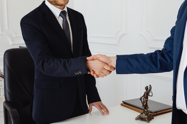 two people shaking hands