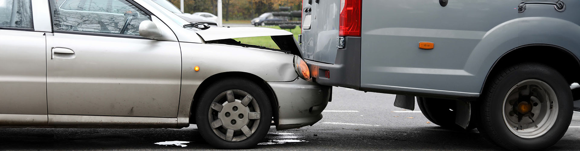 A rear end collision between a car and pickup truck - Auto Accident Lawyer concept image