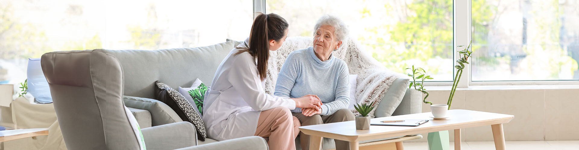 doctor with senior woman in nursing home