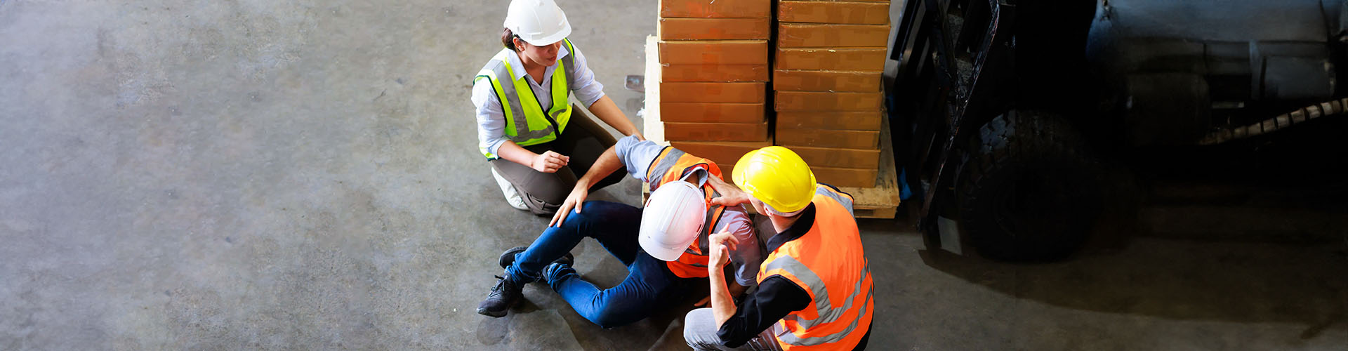 top view. first aid and safety first. engineering talking on walki talki radio to employee while his warehouse coworker 