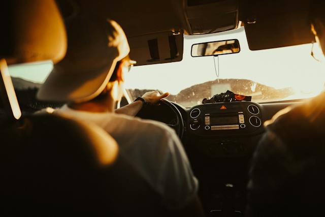 man in hat driving