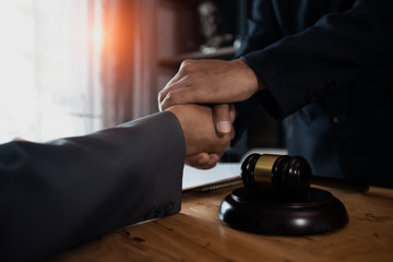 handshake over gavel