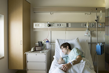 man in hospital bed