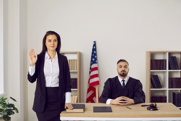 woman swearing in with judge