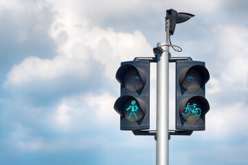 traffic lights with clouds behind